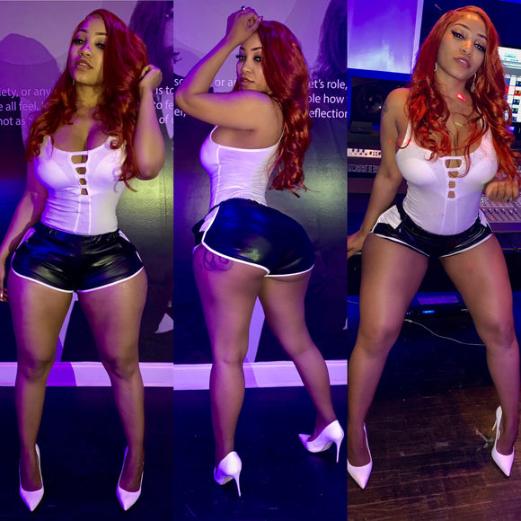 White onesie top with faux leather jogger shorts